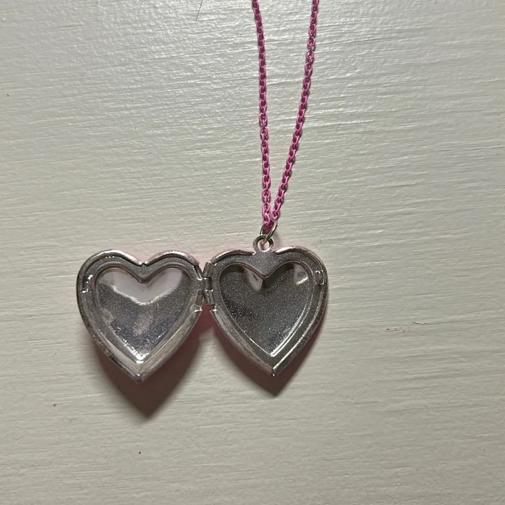 Kids 16” pink chained necklace with pink flower locket that opens. Gently used